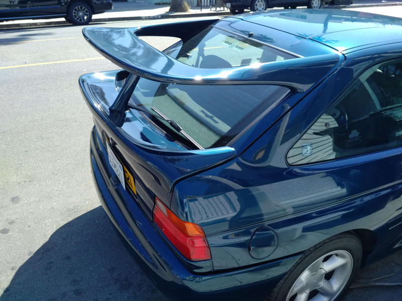Illustration for article titled Who put a Merkur wing on an old BMW 3 series?!